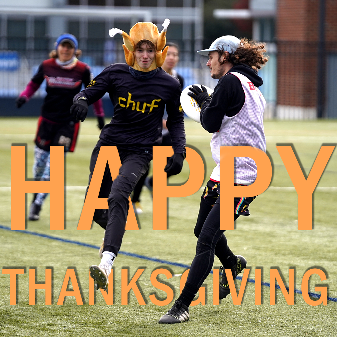 A player wearing a turkey hat playing frisbee